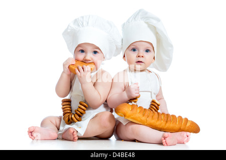 Little bakers kids boy and girl Stock Photo