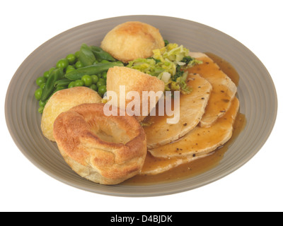 Traditional English Sunday Lunch, Roast Pork With Vegetables And Gravy, Isolated Against White Background, No People Stock Photo