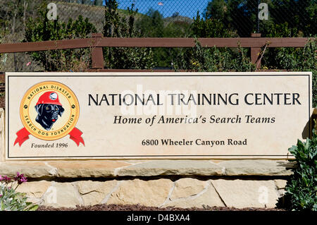 March 01, 2013 - Santa Paula, CA, US - Signage at the entrance to the Search Dog Foundation Training Center.  The SDF is a non-profit, non-governmental organization which strengthens disaster preparedness in the US by partnering rescued dogs with firefighter handlers to find people buried alive in the wreckage of disasters.  The teams are provided at no cost to fire departments and other emergency agencies throughout the country.  SDF teams have aided in dozens of disasters, including the 9/11 attack, the Oklahoma City bombing, the Haiti earthquake, Hurricanes Rita and Katrina, the tsunami in  Stock Photo