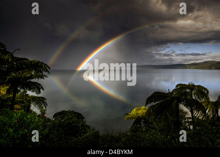 Double rainbow reflected in Lake Tarawera, Rotorua, New Zealand Stock Photo