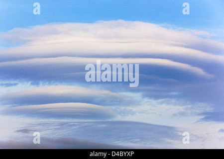 Blue sky with lenticular cloud formations, a rare natural phenomenon ...