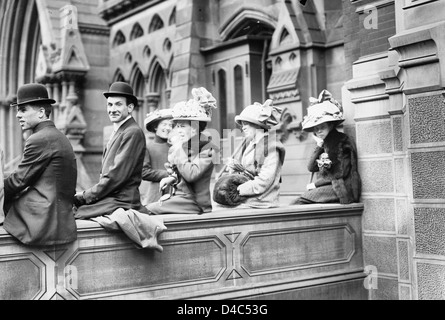 Watching Easter Parade from church steps, 5th Avenue, New York City, circa 1920 Stock Photo