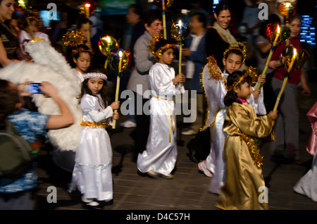 Children dressed as angels in a Christmas Eve posada, Oaxaca, Mexico. Stock Photo