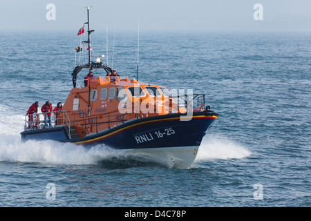 RNLI lifeboat crew at sea in new Tamar class vessel 'Kiwi' in Moelfre, Isle of Anglesey, North Wales, UK, Britain Stock Photo