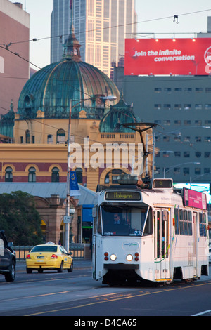 Tram on St Kilda Road with Flinders Street Station and city skyline in background. Melbourne, Victoria, Australia Stock Photo