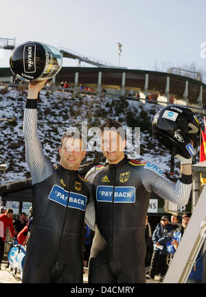 Andre Lange (L) and Marc Kuehne (R) of Germany cheer winning the Two-Man-Bob World Cup in Winterberg, Germany, 09 February 2008. A 9th place was good enough to win the overall standings. Photo: BERND THISSEN Stock Photo
