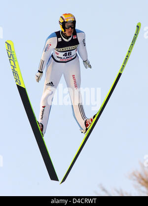 Swiss Andreas Kuettel shown in the air during a jump at the World Cup event at 'Muehlenkopfschanze' in Willingen, Germany, 17 February 2008. He finished the competition 15th with 257,7 points. Photo: Arne Dedert Stock Photo