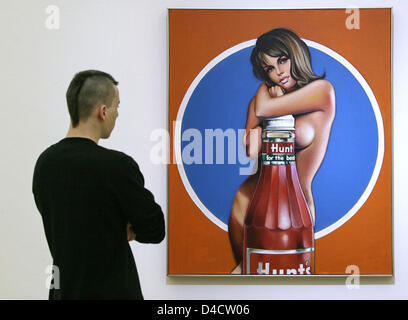 A visitor examines the oil painting 'Hunt for the Best' by US artist Mel Ramos during the opening press conference of the exhibition 'PopArtPortraits' at 'Staatsgalerie Stuttgart' (State Gallery Stuttgart), Stuttgart, Germany, 21 February 2008. Until 6th June the exhibition puts on display major works from the pop art period by US artists such as Andy Warhol and Roy Lichtenstein, b Stock Photo