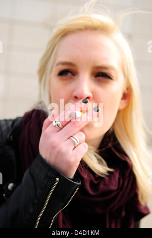 Nottingham, UK. 12th March 2013. Some buildings and shopping centers have banned the smoking of e-cigarettes in Nottingham city center.Student smoking e-cigarette.  Credit:  Ian Francis / Alamy Live News Stock Photo