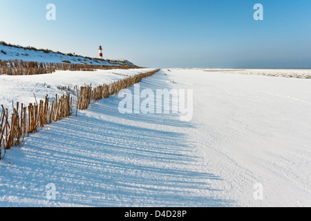 Ellenbogen with lighthouse in winter, Sylt, Germany Stock Photo