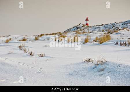 Ellenbogen with lighthouse in winter, Sylt, Germany Stock Photo