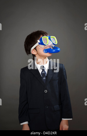 Boy wearing suit jacket and snorkel mask Stock Photo