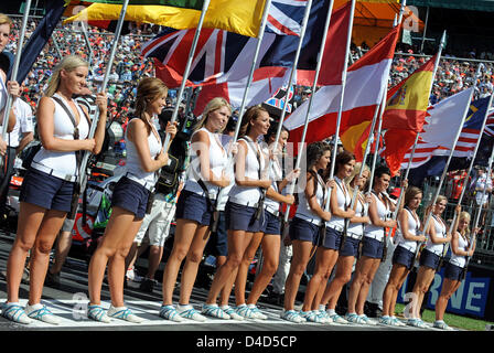 Grid girls line up before the start of the Formula 1 Australian Grand Prix at Albert Park circuit in Melbourne, Australia, 16 March 2008. British Lewis Hamilton of McLaren-Mercedes homed a pole-to-flag victory in an action-packed and crash-strewn Australian GP. Photo: Gero Breloer Stock Photo