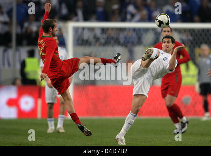 Alexandros Tziolis of Greece (R) and Portugal's Raul Meireles kick for the ball in the test cap Portugal v Greece at LTU Arena stadium in Duesseldorf, Germany, 26 March 2008. Greece defeated Portugal 2-1. Photo: Federico Gambarini Stock Photo