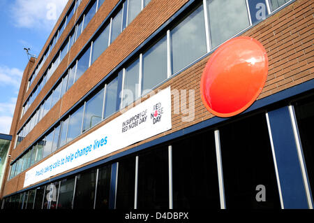 Nottingham, UK. 12th March 2013. Experian showing thier support for Red Nose Day.call center with banner and giant red nose.Talbot Street city. Credit:  Ian Francis / Alamy Live News Stock Photo