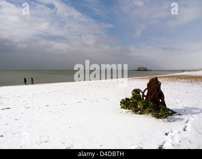 Brighton, East Sussex, UK. 12th March 2013. Brighton beach towards the old West Pier. After a night of chaos on the roads caused by snow and ice, the people of Brighton woke up to a winter wonderland. Credit:  Peter Greenhalgh (UKpix.com) / Alamy Live News Stock Photo