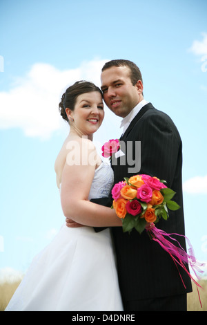 Bride and Groom posing outside Stock Photo