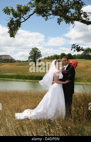 Bride and Groom posing outside Stock Photo