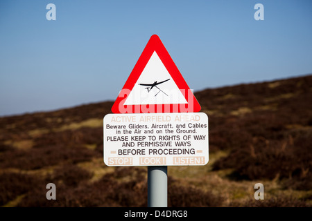 Warning sign of low-flying gliders on the top of the Long Mynd, near the Midland Gliding Club, Church Stretton, Shropshire Stock Photo