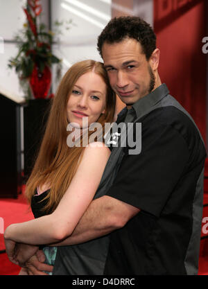 German actress Sina-Valeska Jung (L) and US bassist 'Evil' Jared Hasselhoff (R), bassist for US fun rock band Bloodhound Gang, pose during shootings of German soap opera 'Verbotene Liebe' (Forbidden Love) in Cologne, Germany, 17 April 2008. Evil Jared and Sina-Valeska Jung are in a relationship since two years, he will guest star in the episode 3,183 and 3,184 to be aired by German Stock Photo