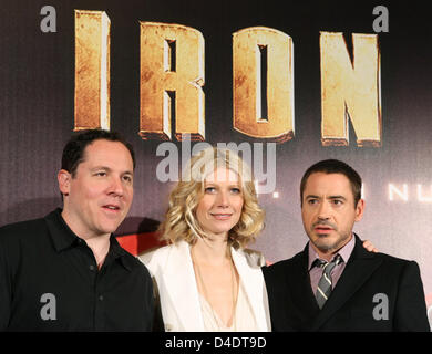 US actress Gwyneth Paltrow, her colleague Robert Downey jr. and director Jon Favreau smile during a photo call on the occasion of the Germany premiere of their action film 'Iron Man' (to take place the same evening) in Berlin, Germany, 22 April 2008. Paltrow acts as assistant of weapon dealer Tony Stark (Downey Junior). After a kidnapping 'Iron Man' Stark takes up the fight against Stock Photo