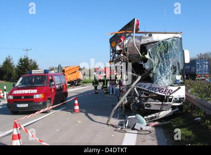 Several people were injured in a bus accident on A 24 Berlin-Hamburg, Germany, 23 April 2008. About 60 youngsters were in the bus at the time of the accident, according to early police reports. Nine were admitted to hospital while seven were treated at the crash scene, said a spokeswoman. The driver crashed into a guarding rail after loosing control over his vehicle during an overt Stock Photo