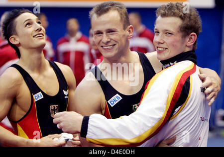 (L-R) Germany's Marcel Nguyen, Robert Juckel und Fabian Hambuechen celebrate winning the silver medals in the team finals of the 28th European Men's Artistic Gymnastics Championships in Lausanne, Switzerland, 10 May 2008. Photo: FRANK MAY Stock Photo