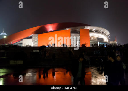 Visitors leaving the stadium of the Nanjing Olympic Sports Center after a football match of Jiangsu Sainty FC. Stock Photo