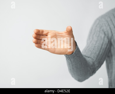 man holding imaginary object Stock Photo