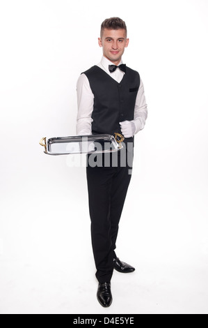 Young person in a suit holding an empty tray isolated on white background Stock Photo