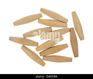 A group of tapered hardwood dowels on a white background. Stock Photo