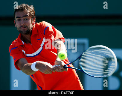 10 March, 2013: Marin Cilic of Croatia returns a shot to Albert Ramos of Spain during the BNP Paribas Open at Indian Wells Tennis Garden in Indian Wells CA. Stock Photo