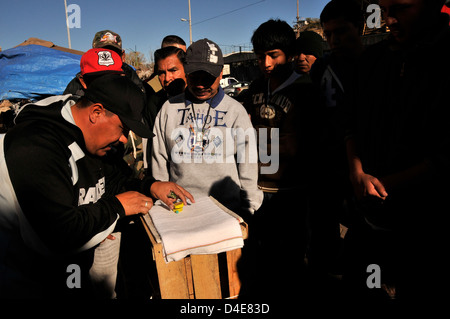 Men gamble on the plaza in Nogales, Sonora, Mexico. Stock Photo