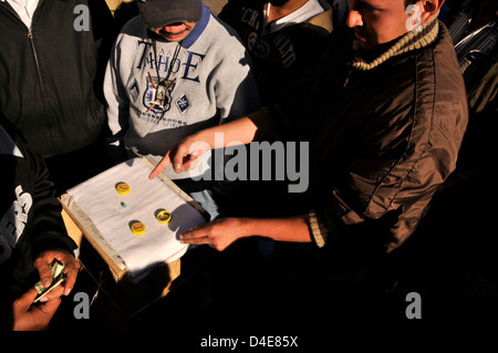 Men gamble on the plaza in Nogales, Sonora, Mexico. Stock Photo