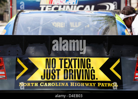 'No Texting. Just Driving' safety message on a race car in downtown Raleigh, North Carolina, USA Stock Photo