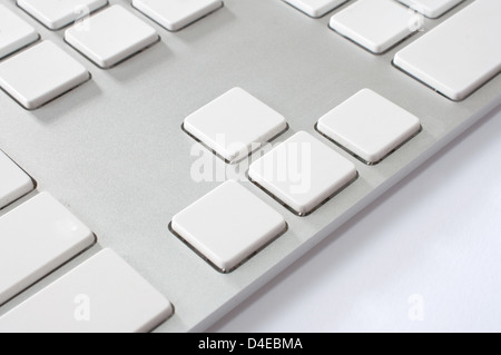 Close up image of a modern stylish aluminum white computer keyboard with blank keys for your own idea. Stock Photo