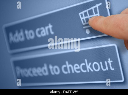 Finger Touching Add To Cart Button on Computer Screen Stock Photo