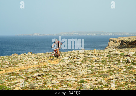 Mountain biker on the Cami de Cavalls coastal path near Ciutadella on Menorca in the Balearic islands, Spain Stock Photo