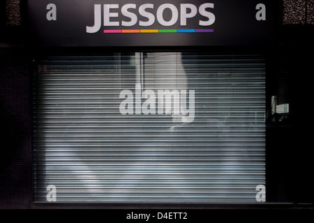 The metal shutters are down on the recently closed Jessops photo store in a side street of the City of London, the heart of the capital's financial district. Jessops’ store closures made over 1,350 staff redundant when they shut up shop at the start of the year with administrators PricewaterhouseCoopers admitting that at least some of the 192 stores would close. Other high-street chains such as HMV and the video chain, Blockbuster also closed at the beginning of 2013. Stock Photo