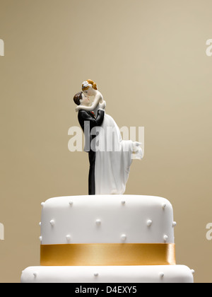 Bride and groom topper on wedding cake Stock Photo