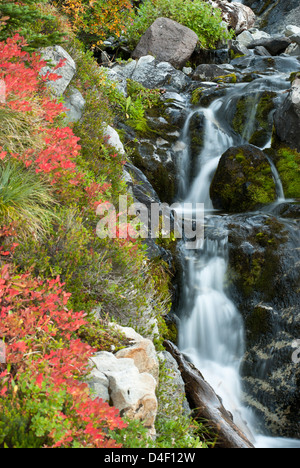 Waterfall rushing over rocky hillside Stock Photo