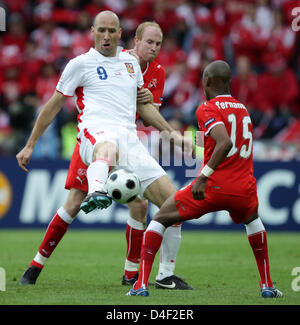 Ludovic Magnin and Gelson Fernandes of Switzerland vies with Jan Koller of Czech Republic during the EURO 2008 preliminary round group A match in St. Jakobs Arena, Basel, Switzerland, 07 June 2008. Photo: Ronald Wittek dpa +++###dpa###+++ Stock Photo