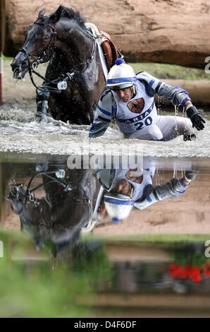 Australian Andrew Hoy falls off his horse Gros Monet during the terrain exercise of the International eventing tournament in Luhmuehlen, Germany, 14 June 2008. Photo: KAY NIETFELD Stock Photo