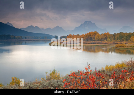 Rural landscape reflected in still river Stock Photo