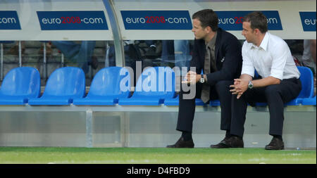 Team Manager Oliver Bierhoff (L) and assistant coach Hansi Flick of Germany talk prior to the UEFA EURO 2008 quarter final match between Portugal and Germany at the St. Jakob-Park stadium in Basel, Switzerland 19 June 2008. Germany won 3-2. Photo: Ronald Wittek dpa +please note UEFA restrictions particulary in regard to slide shows and 'No Mobile Services'+ +++###dpa###+++