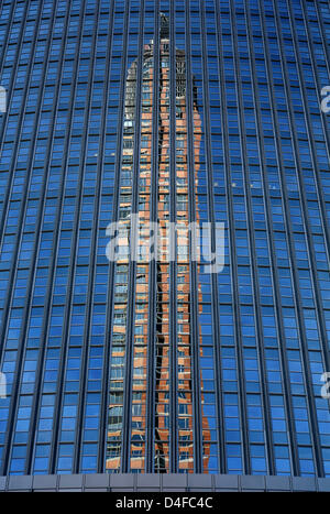 Fair tower 'Messeturm' is reflected in a skyscraper's glass facade in Frankfurt Main, Germany, 17 June 2008. Photo: Frank May Stock Photo