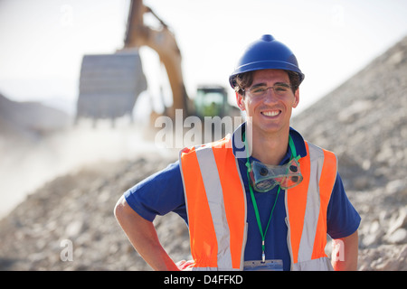 Worker smiling in quarry Stock Photo