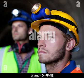 Close up of worker's face in tunnel Stock Photo