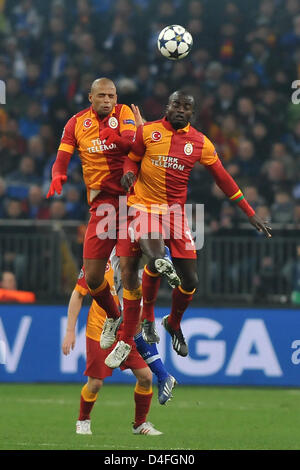 Galatasaray's Felipe Melo and Dany Nounkeu try to perform a header during the UEFA Champions League round of 16 second leg soccer match between FC Schalke 04 and galatasaray Istanbul at the Veltins-Arena in Gelsenkirchen, Germany, 12 March 2013. Photo: Revierfoto Stock Photo