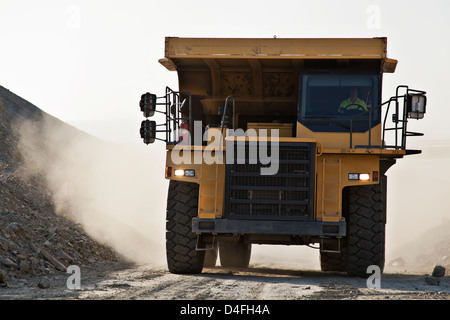 Machinery driving on road in quarry Stock Photo